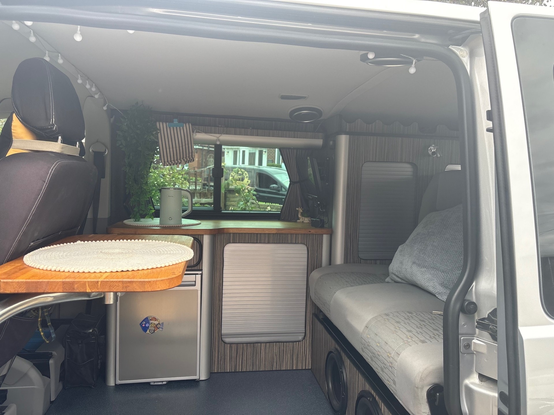 Campervan seats folded down into a bed